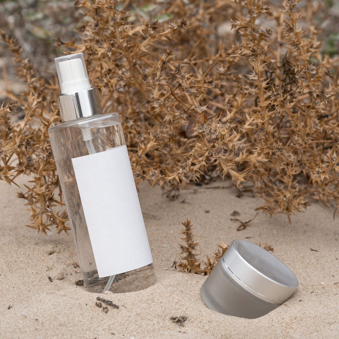 beauty-products-arrangement-sand